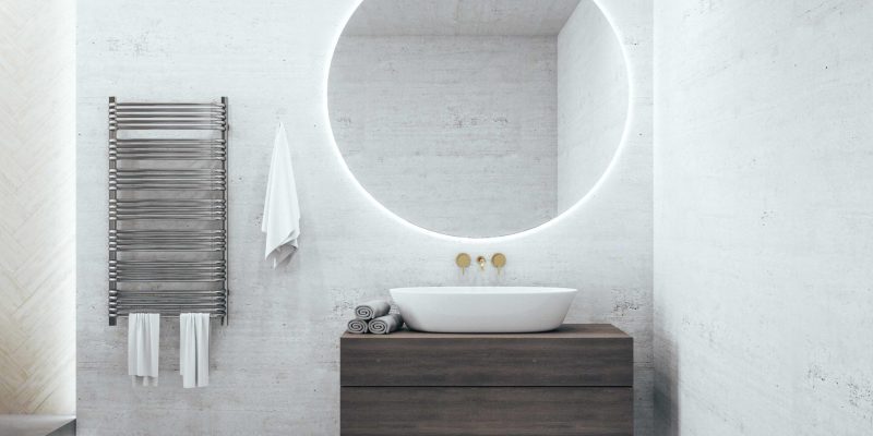 Modern loft bathroom with mirror on wall, comfortable white bathtub and self care products. 3d rendering